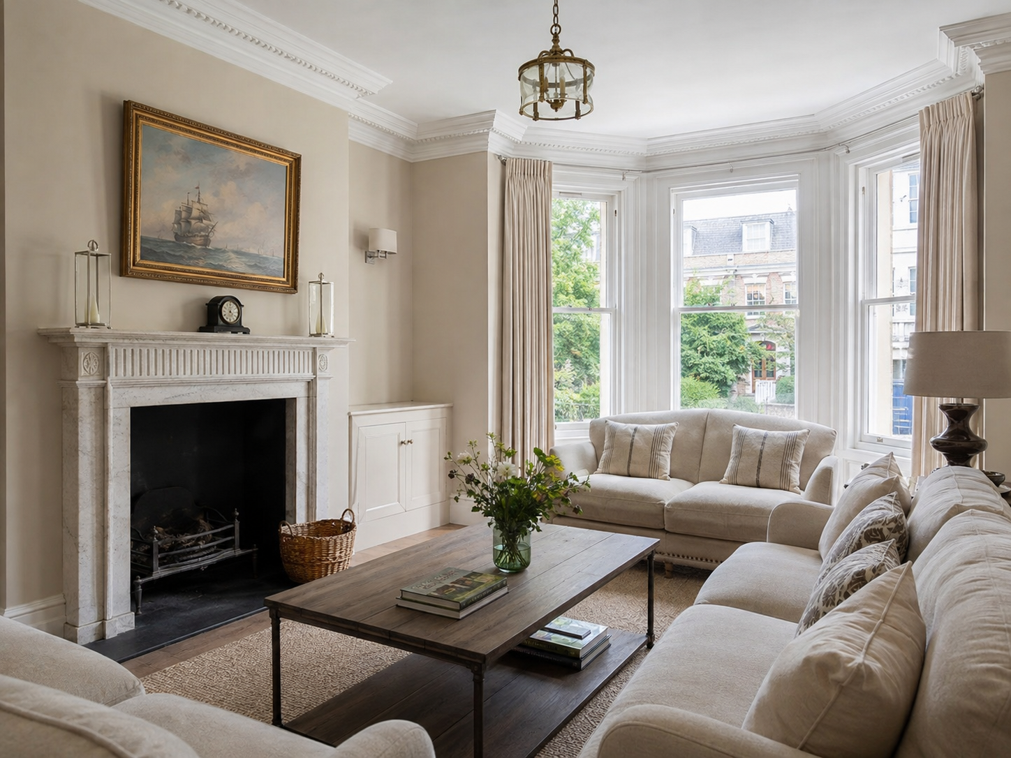 Finished period living room with neutral walls and crisp white woodwork in Chichester
